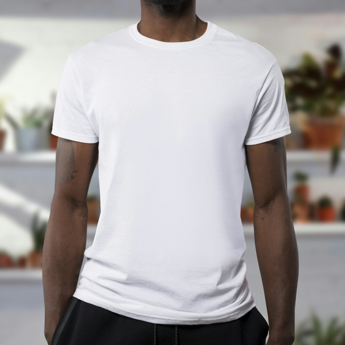 Model-worn white shirt used as an apparel editing reference